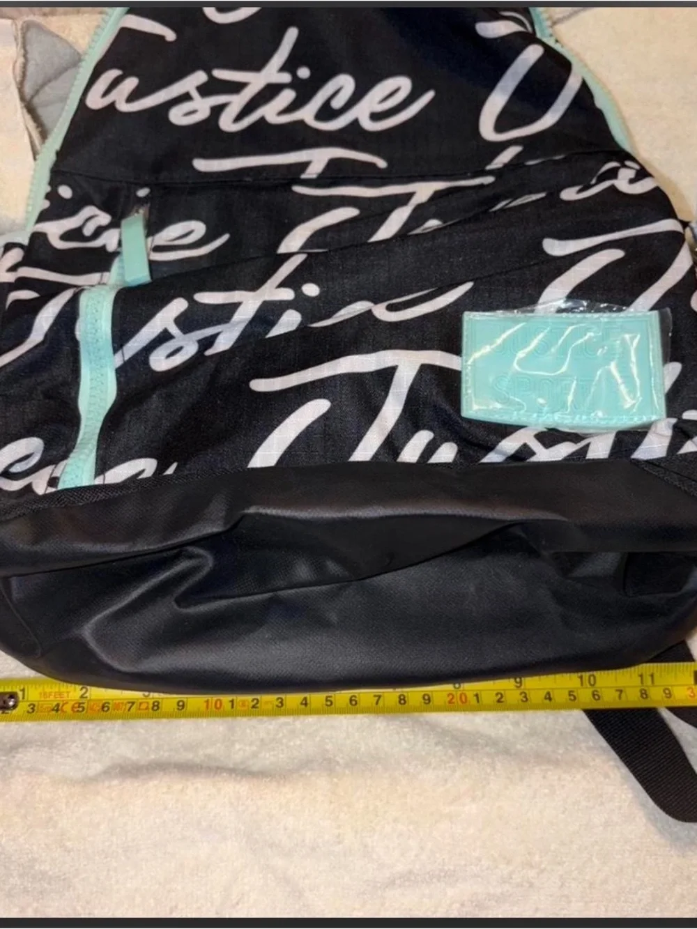 Justice Black Backpack with Mint Trim and White Script